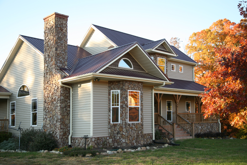 Two story house with large brick chimney